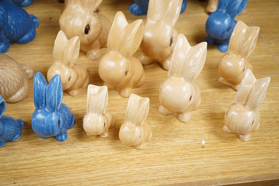 A collection of Sylvac bunny figures, one in the form of a teapot and a pair of dogs, largest 25cm high